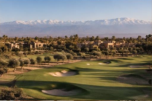 Amelkis fairway with residences and distant Atlas mountains